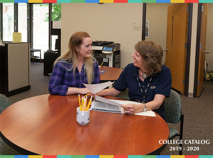 Student and Advisor Sitting at a Table